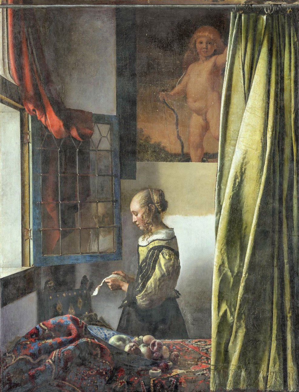 «Девушка, читающая письмо у открытого окна» Яна Вермеера с расчищенным во время реставрации изображением на заднем плане. Около 1657. Фото: Wolfgang Kreische